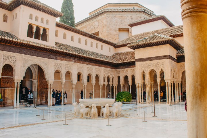 a group of people in front of a building